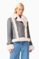 Brunette model wearing the Isolda Jacket in Grey close up shot