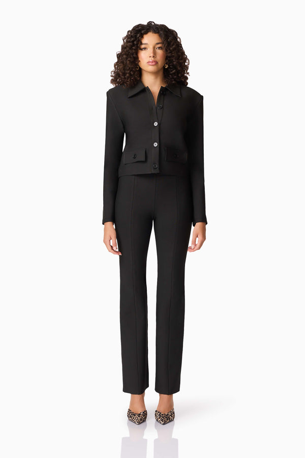 Brunette model wearing CURAAE Nora Jacket & Pants Set in Black front shot