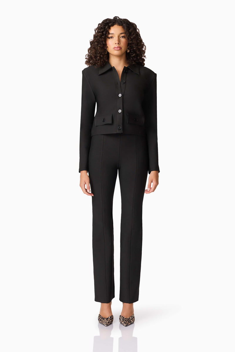 Brunette model wearing CURAAE Nora Jacket & Pants Set in Black front shot