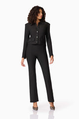 Brunette model wearing CURAAE Nora Jacket & Pants Set in Black posed shot
