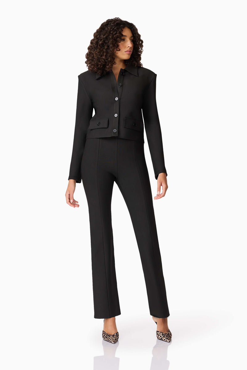 Brunette model wearing CURAAE Nora Jacket & Pants Set in Black posed shot