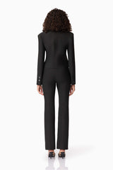 Brunette model wearing CURAAE Nora Jacket & Pants Set in Black back shot