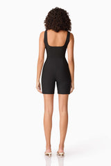Brunette model wearing CURAAE Nora Unitard in Black back shot