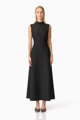 Blonde model wearing CURAAE Nora Sleeveless Midi Dress in Black front shot