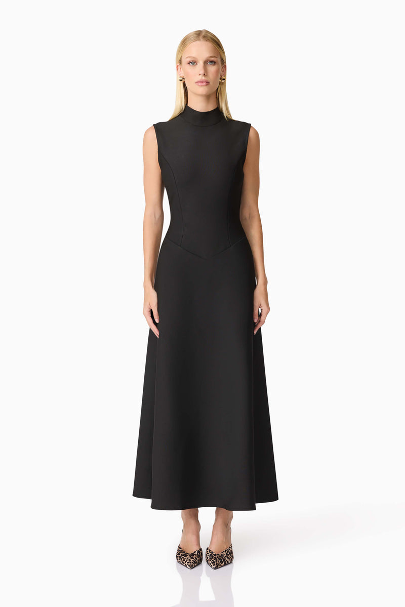 Blonde model wearing CURAAE Nora Sleeveless Midi Dress in Black front shot