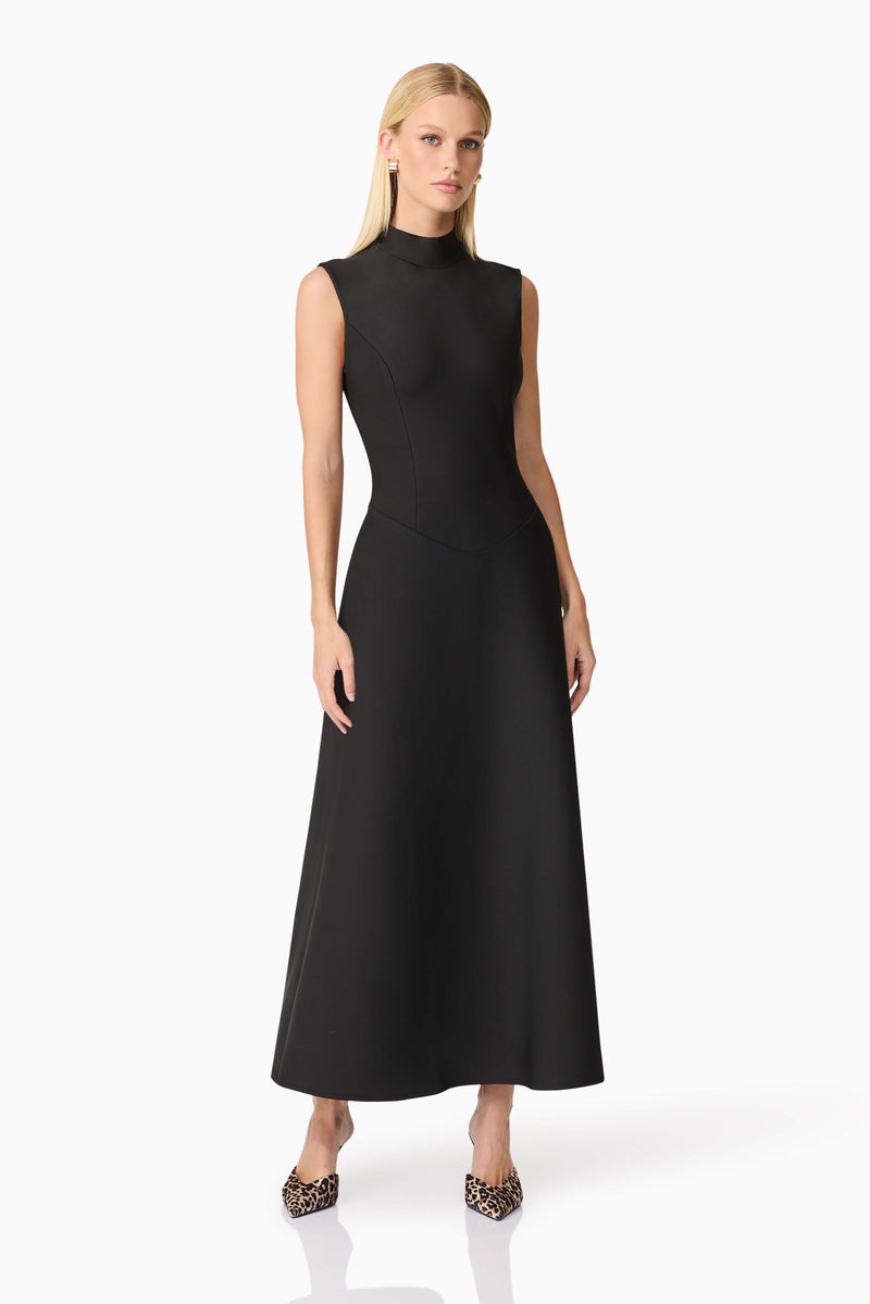 Blonde model wearing CURAAE Nora Sleeveless Midi Dress in Black posed shot