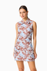 CURAAE Bloomette Shift Mini Dress in Brown and Blue Floral with front pockets close up shot