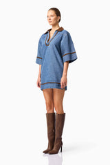 Blonde model wearing CURAAE Rhea Denim Shirt Dress side pose