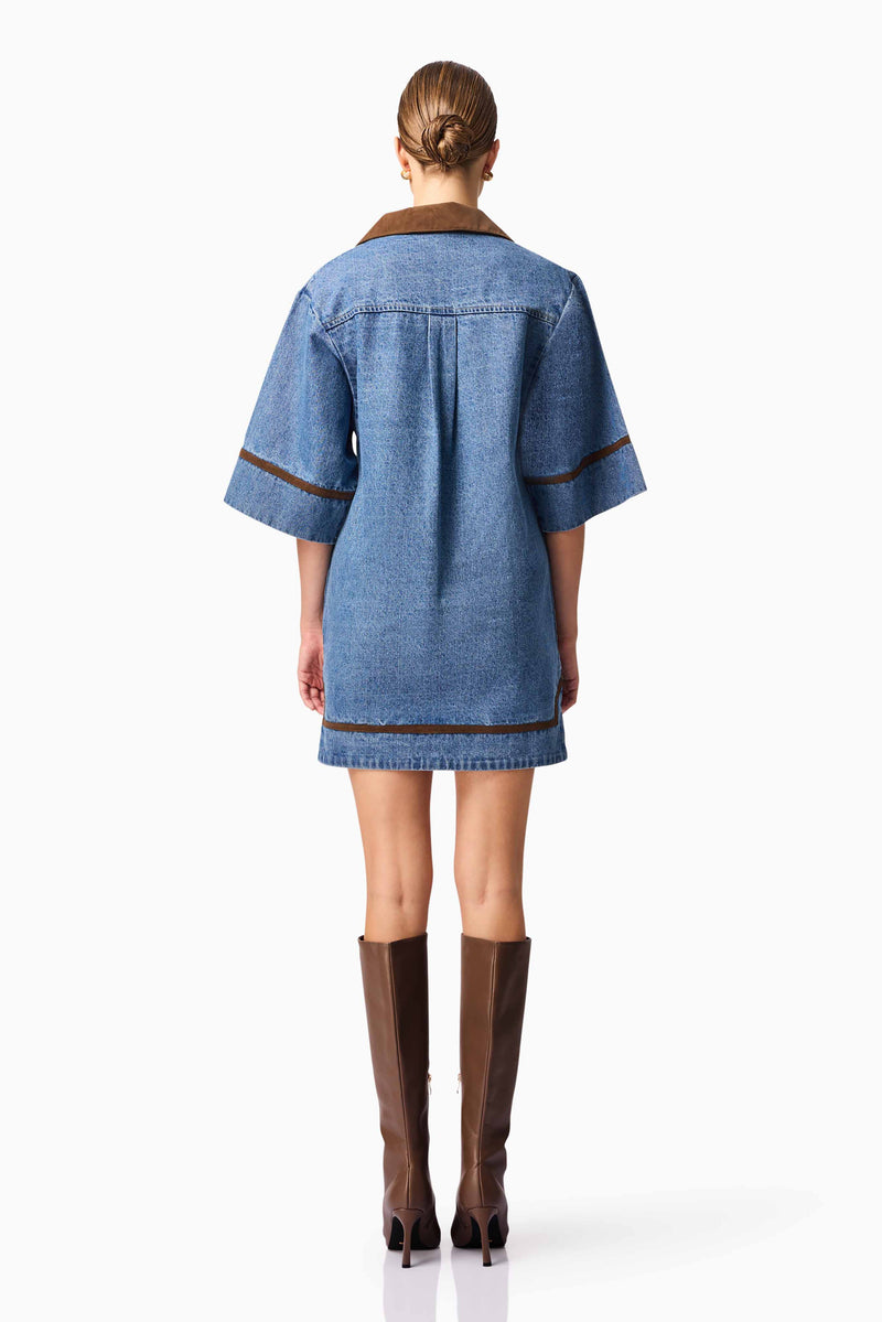 Blonde model wearing CURAAE Rhea Denim Shirt Dress back pose