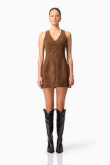 Blonde model wearing CURAAE Venus Suede Mini Dress in Brown front pose