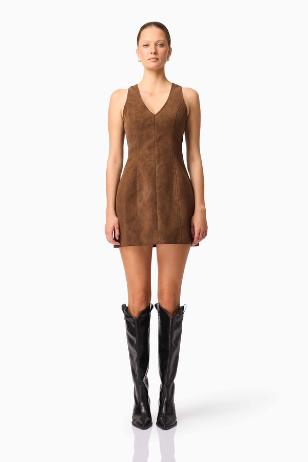 Blonde model wearing CURAAE Venus Suede Mini Dress in Brown front pose