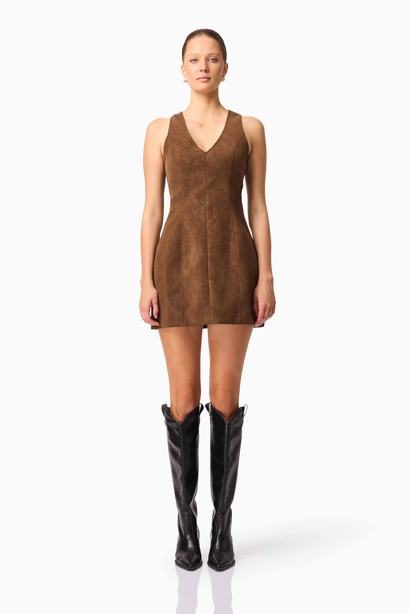 Blonde model wearing CURAAE Venus Suede Mini Dress in Brown front pose