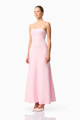 Blonde model wears CURAAE Zahara Strapless Maxi Dress in Pink side pose