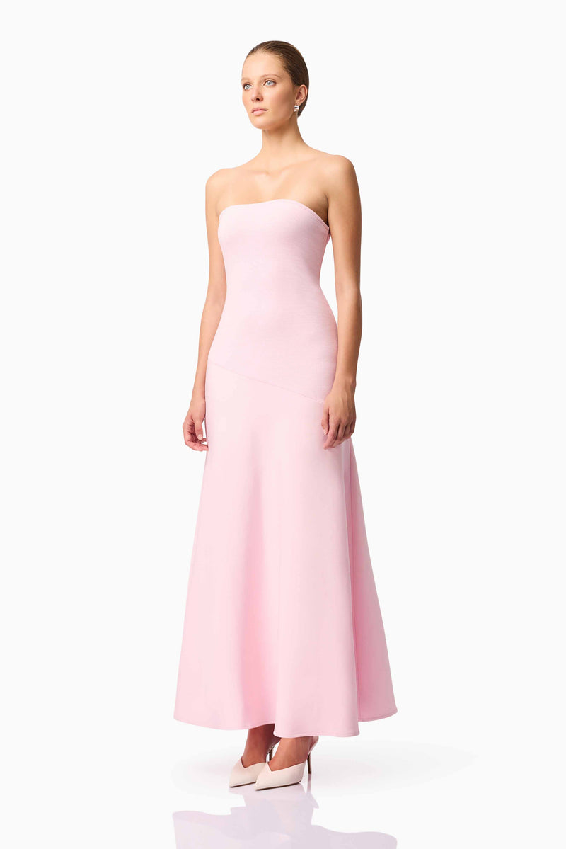 Blonde model wears CURAAE Zahara Strapless Maxi Dress in Pink side pose