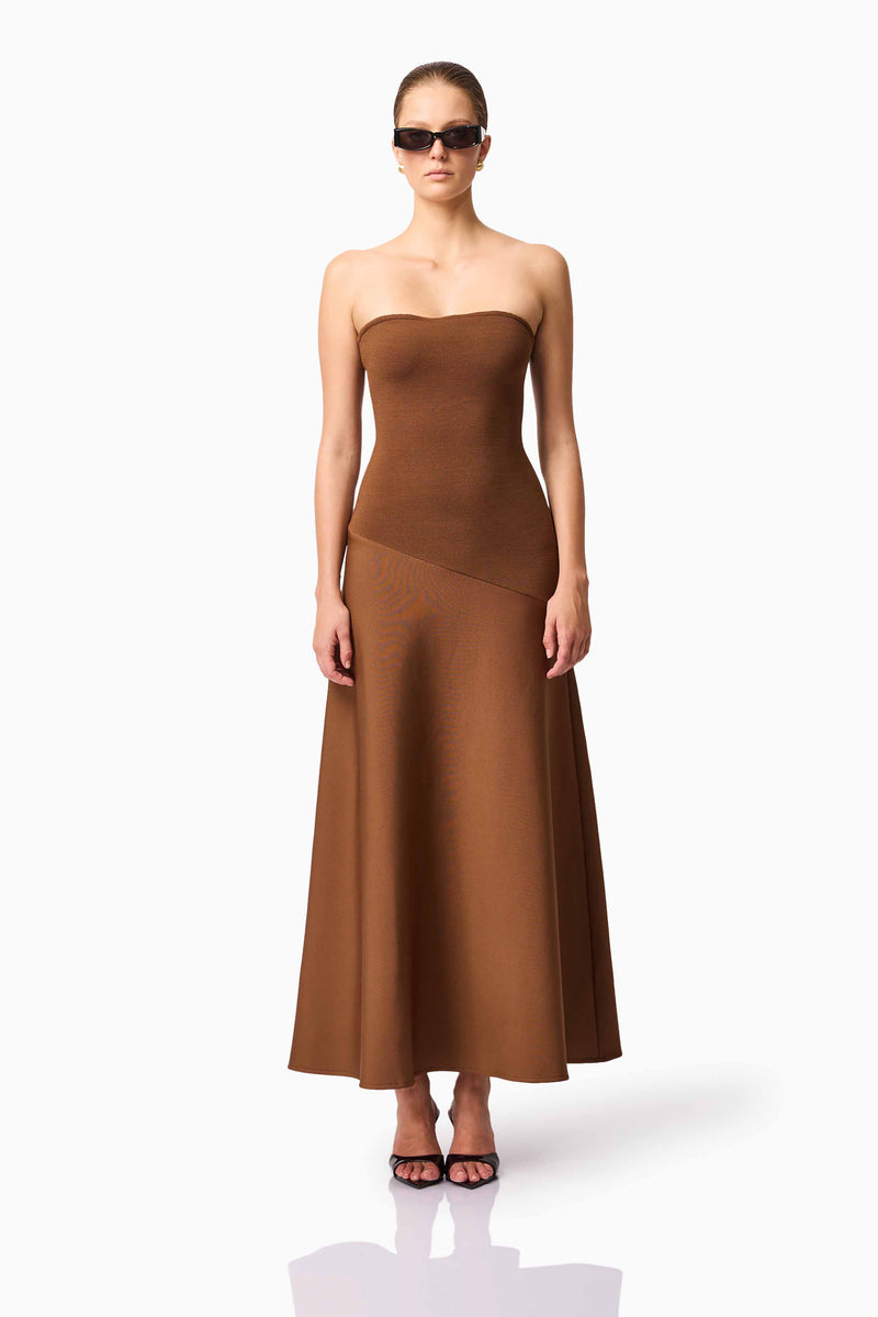 Blonde model wearing CURAAE Zahara Strapless Maxi Dress in Brown front pose