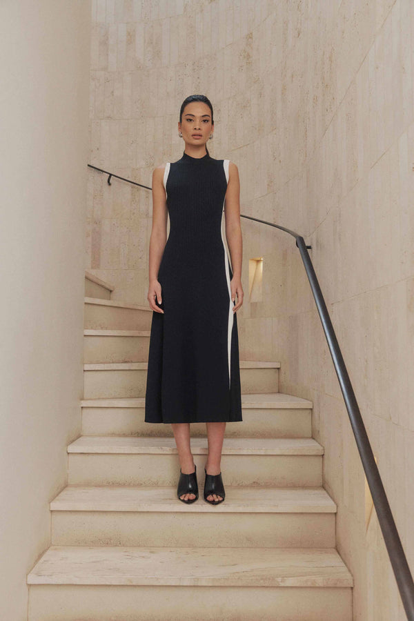 Brunette model wears Berlin Rib Knit Midi Dress in Black front shot