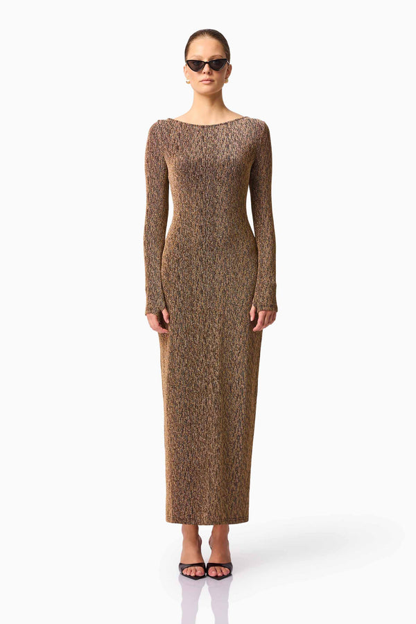 Blonde model wearing CURAAE Emery Long Sleeve Maxi Dress in Gold front pose
