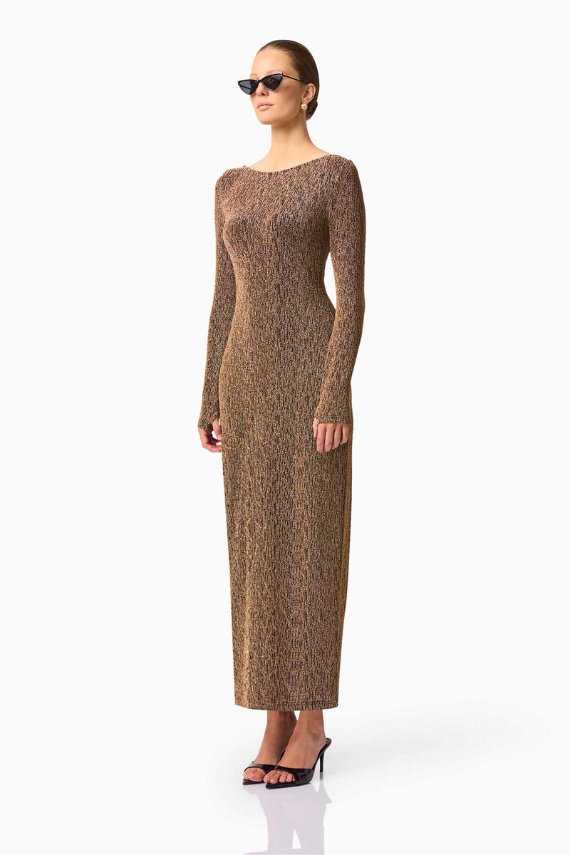 Blonde model wearing CURAAE Emery Long Sleeve Maxi Dress in Gold side pose