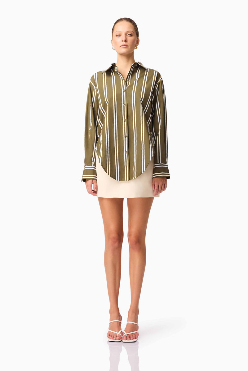 Brunette model wearing Giverny Stripped Shirt in Green front shot