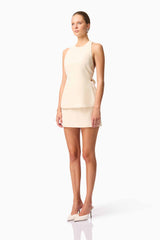 Blonde model wearing CURAAE Ceres Halter Top & Mini Skirt Set In White side pose