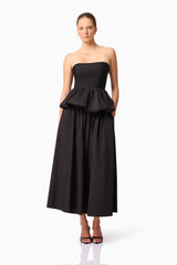 Brunette model wearing Delia Top & Skirt Set in Black posed shot