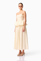 Brunette model wearing Delia Top & Skirt Set in White side shot