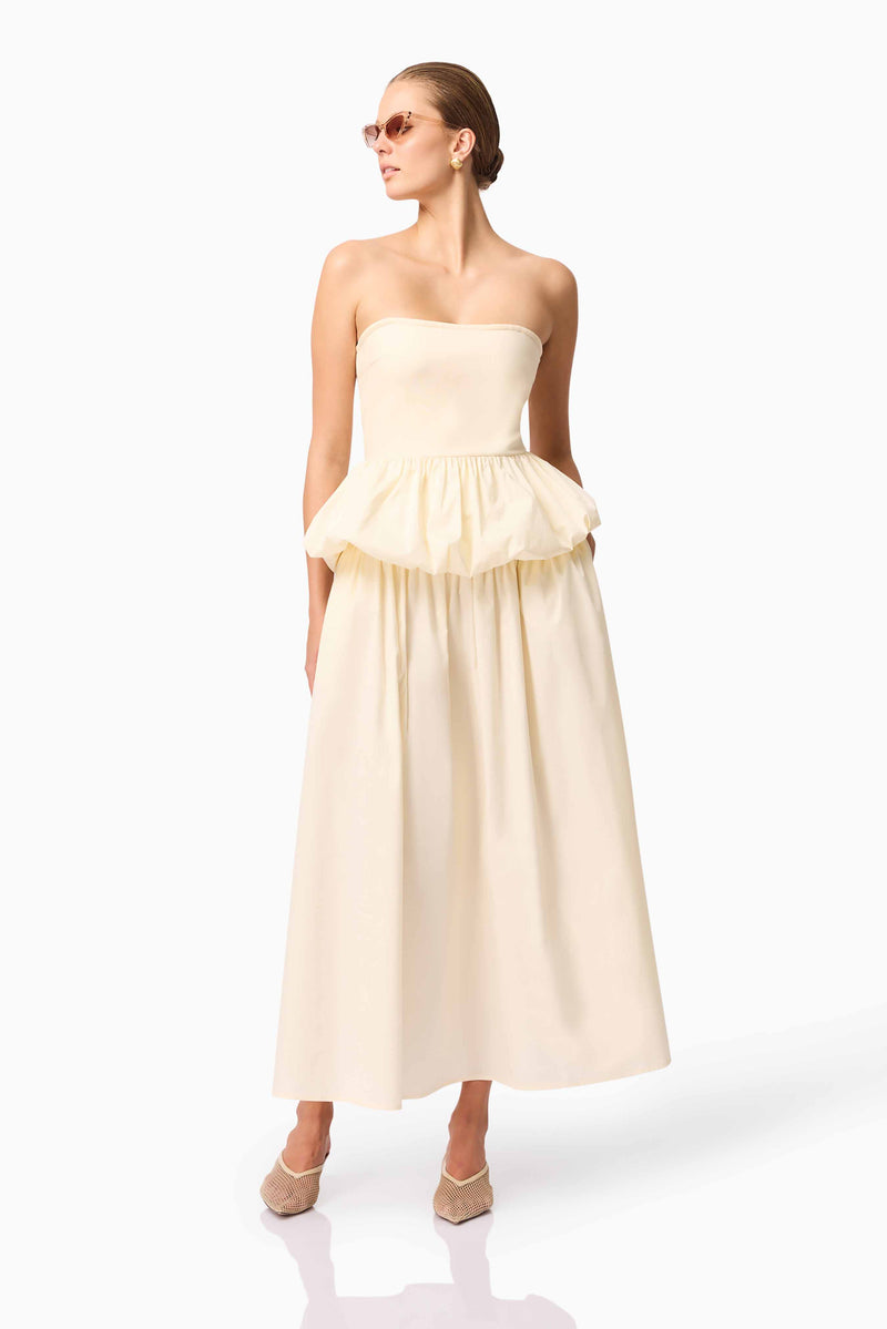 Brunette model wearing Delia Top & Skirt Set in White posed shot