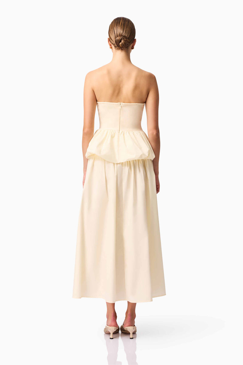 Brunette model wearing Delia Top & Skirt Set in White back shot