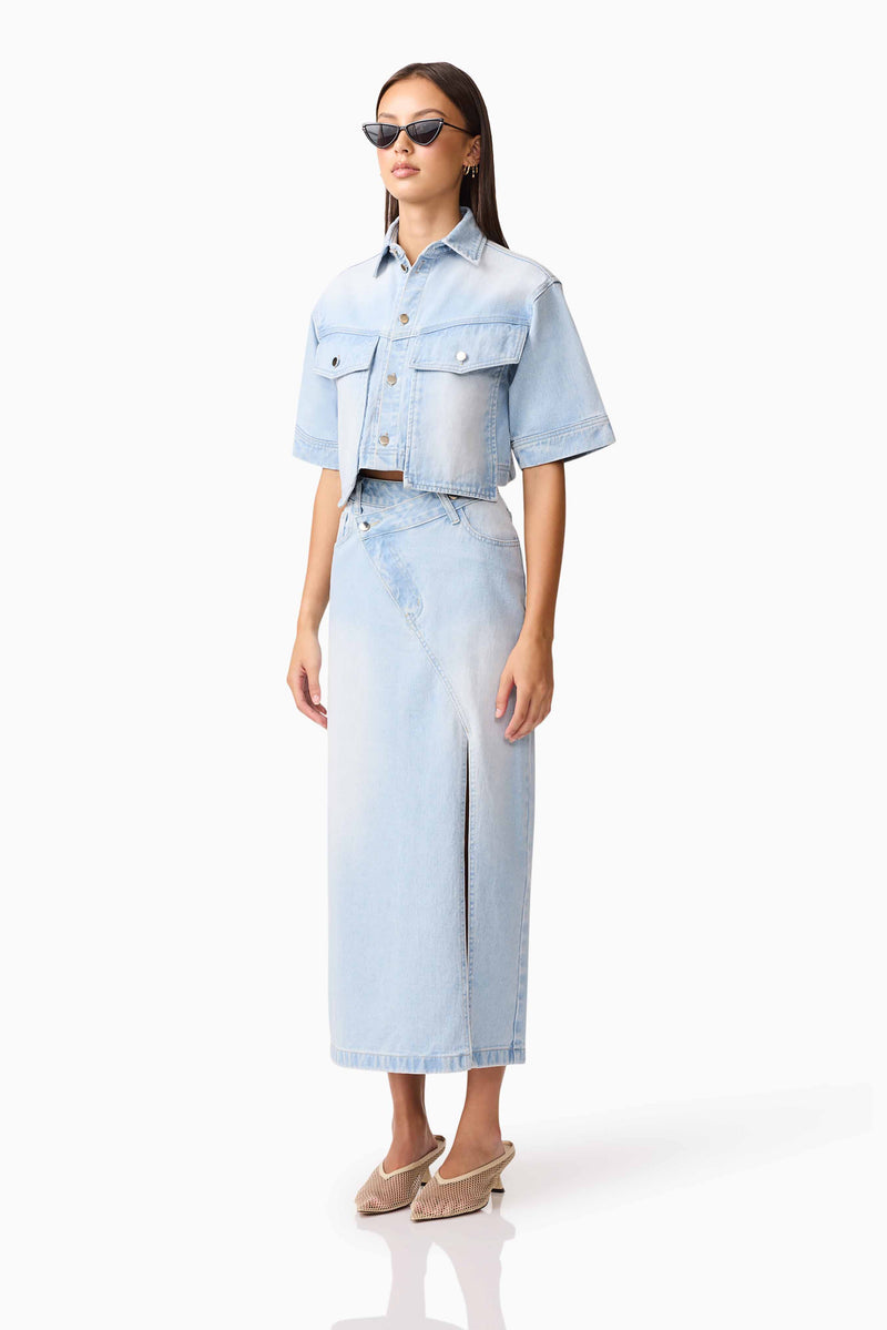 Brunette model wearing Silvie Denim Top & Skirt Set side shot