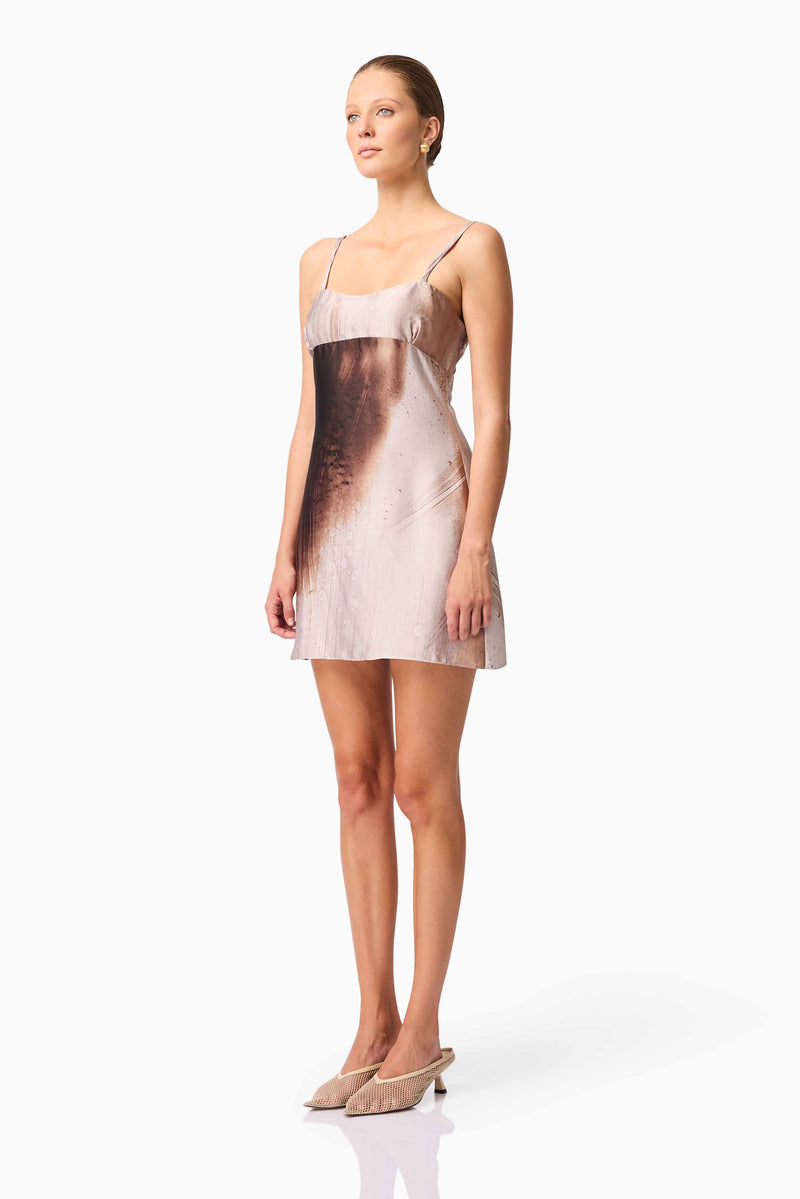 Brunette model wearing Oriellie Sleeveless Mini Dress in Brown Side Shot