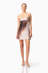 Brunette model wearing Oriellie Sleeveless Mini Dress in Print Posed Shot