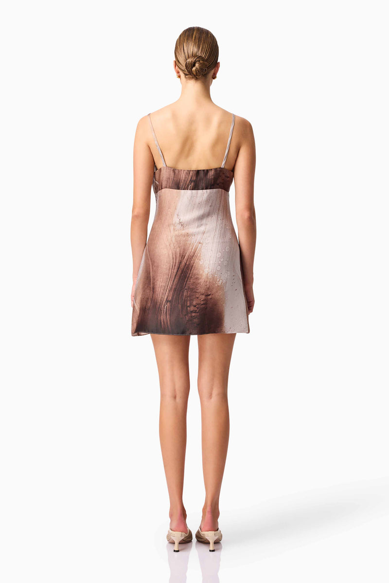 Brunette model wearing Oriellie Sleeveless Mini Dress in Print Back Shot