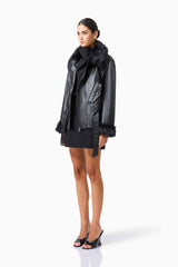 CURAAE Zayelle Jacket in Black with fur around the neck & cuffs side shot 