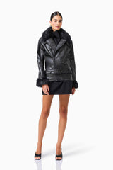 CURAAE Zayelle Jacket in Black with fur around the neck & cuffs posed shot 