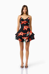 Brunette model wearing the CURAAE Maelis Cowl Neck Mini Dress in Black & Red Floral front shot
