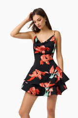 Brunette model wearing the CURAAE Maelis Cowl Neck Mini Dress in Black & Red Floral close up shot
