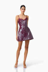 CURAAE Verdita Sequin Mini Dress in Burgundy with lace trim & a-line silhouette posed shot