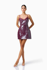 CURAAE Verdita Sequin Mini Dress in Burgundy with lace trim & a-line silhouette posed hands on hips shot