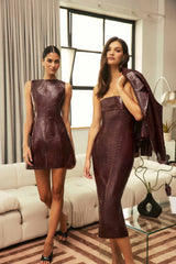 Model wearing the CURAAE Lorea Strapless Midi Dress in Burgundy with croc leather fabrication to a cocktail dinner  