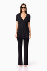 Brunette model wears ANNABELLE KNIT SHIRT front view
