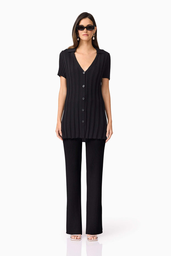 Brunette model wears ANNABELLE KNIT SHIRT front view