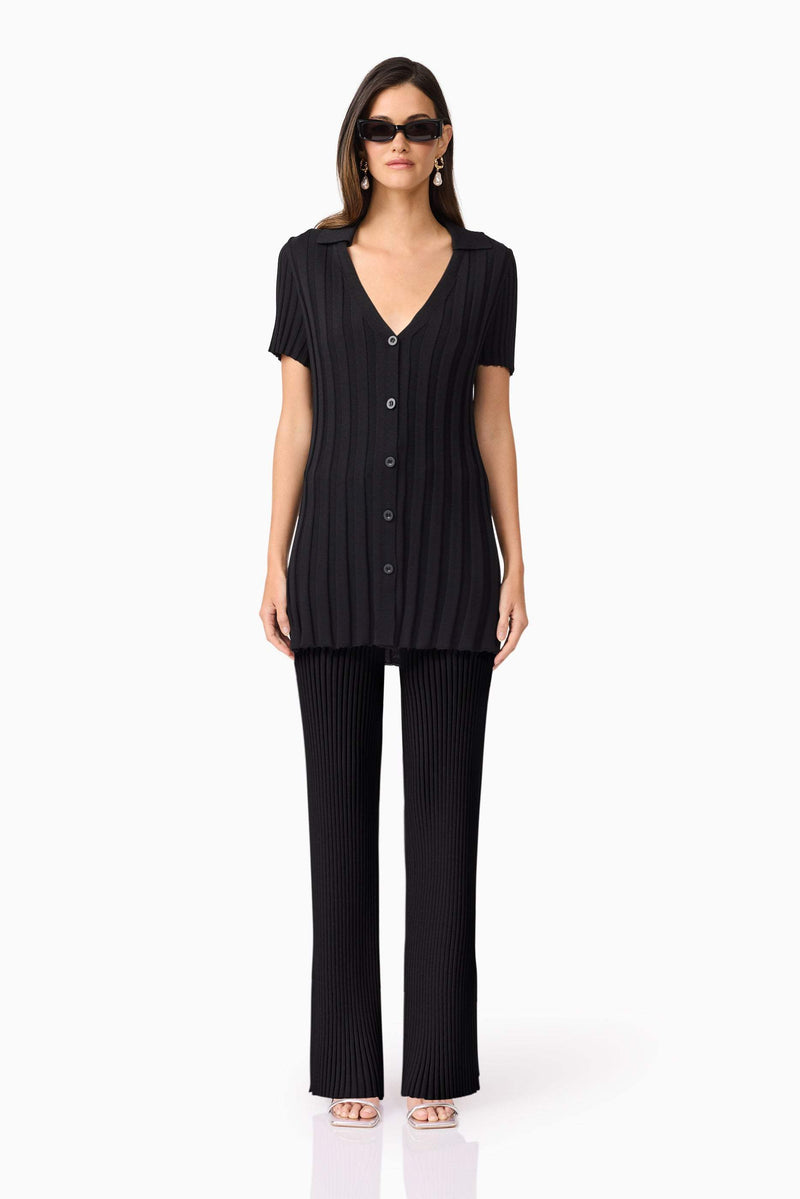 Brunette model wears ANNABELLE KNIT SHIRT front view
