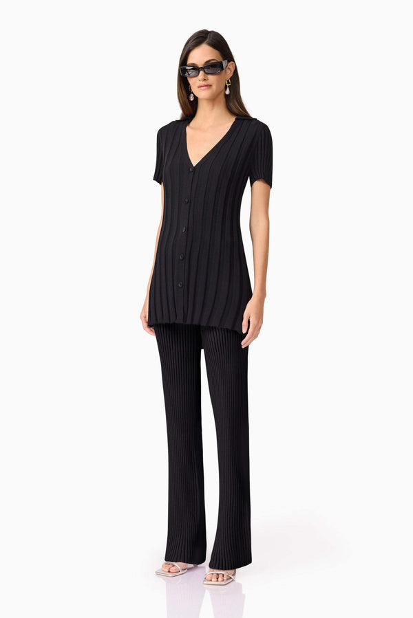 Brunette model wears Annabelle Knit Pants In Black side shot