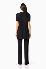 Brunette model wears ANNABELLE KNIT SHIRT back view