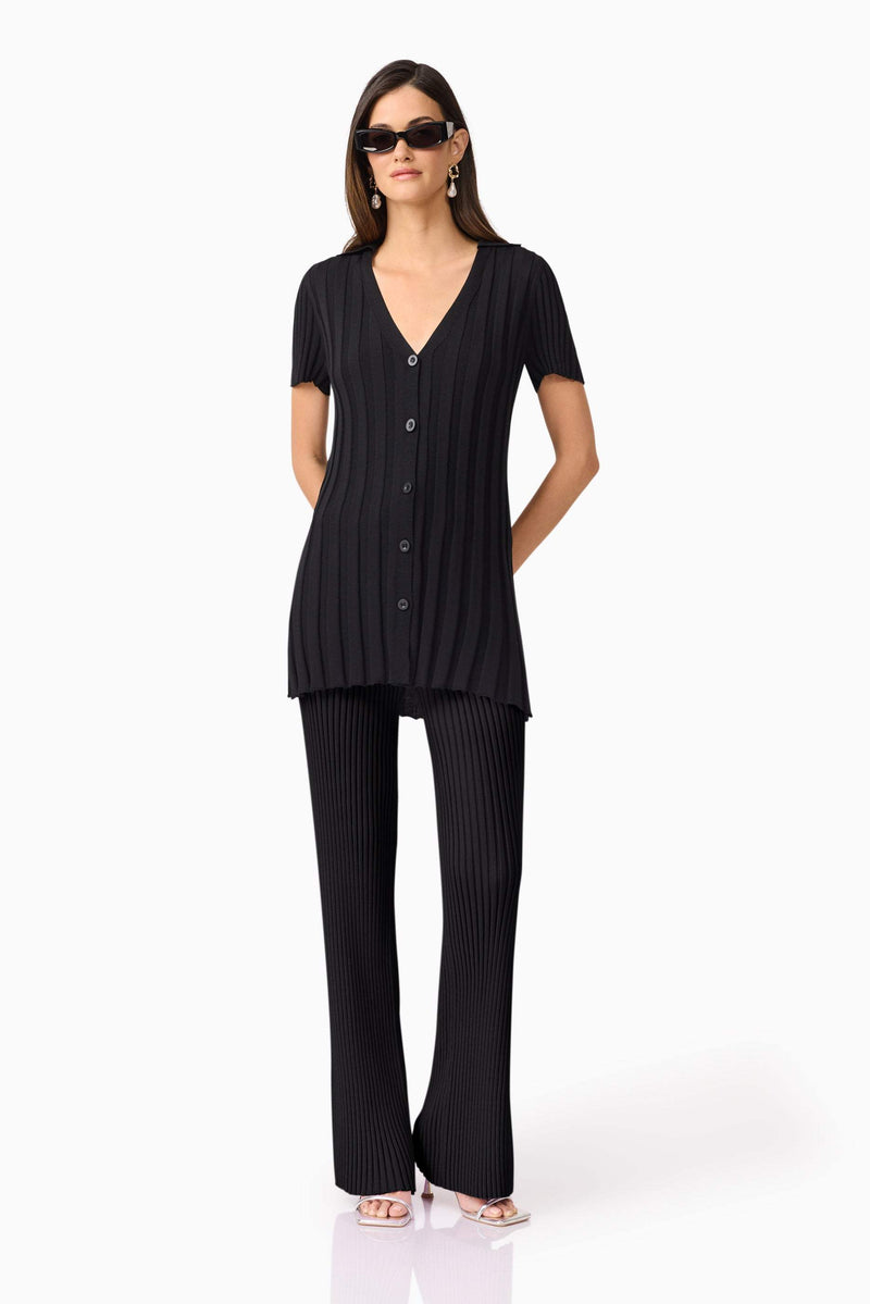 Brunette model wears ANNABELLE KNIT SHIRT front view posing