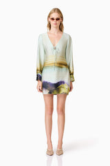 Blonde model wears Willow Satin Mini Dress In Blue front shot