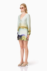 Blonde model wears Willow Satin Mini Dress In Blue side shot
