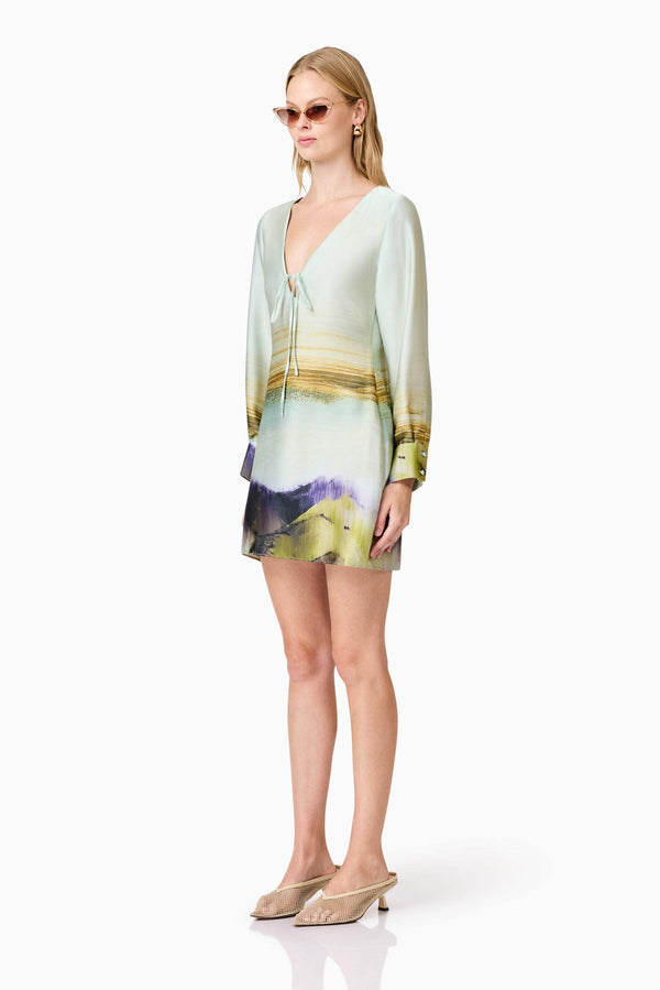 Blonde model wears Willow Satin Mini Dress In Blue side shot