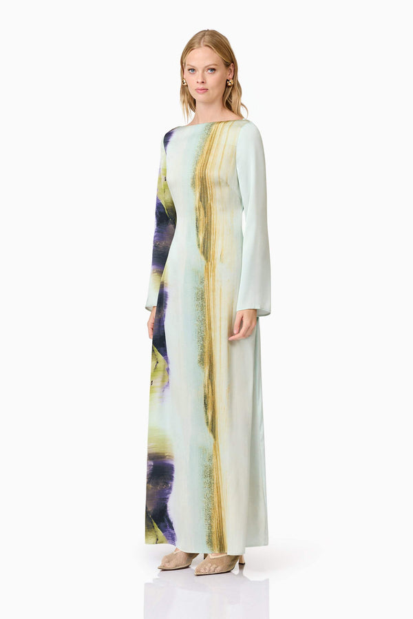 Blonde model wears Willow Satin Maxi Dress In Blue side shot
