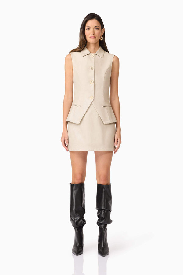 Brunette model wearing  Malia Leather Vest In Beige front shot